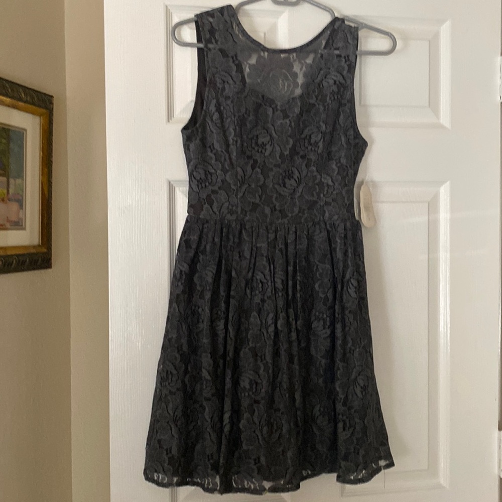 Grey all lace dress,sleeveless and zips in back